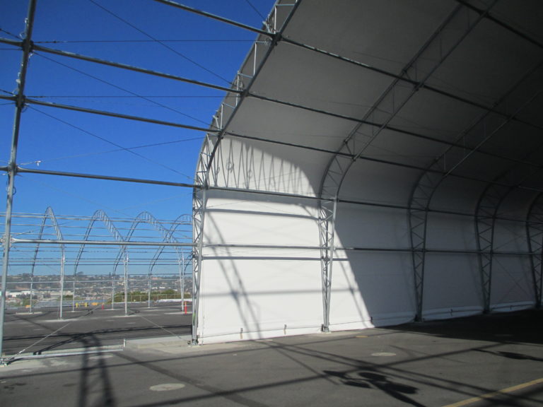 Aircraft shelter covered in white fabric